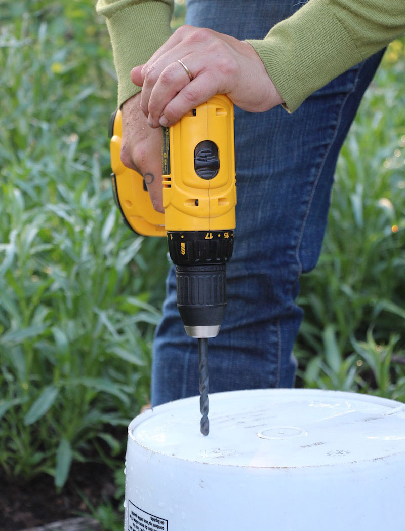 drilling drainage holes in a bucket garden