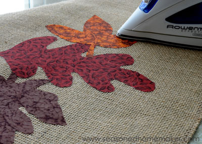 adhering leaves to a burlap table runner with an iron